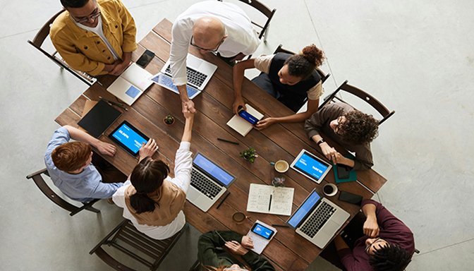 group of people around a table from above