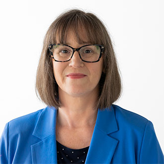 person with glasses looking at the camera