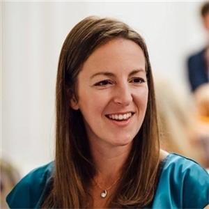 woman with long hair smiling