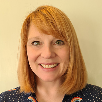 woman with shoulder length hair smiling