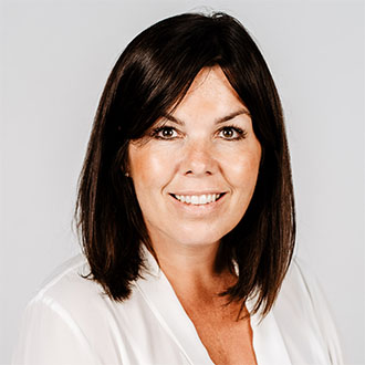 woman with dark hair smiling